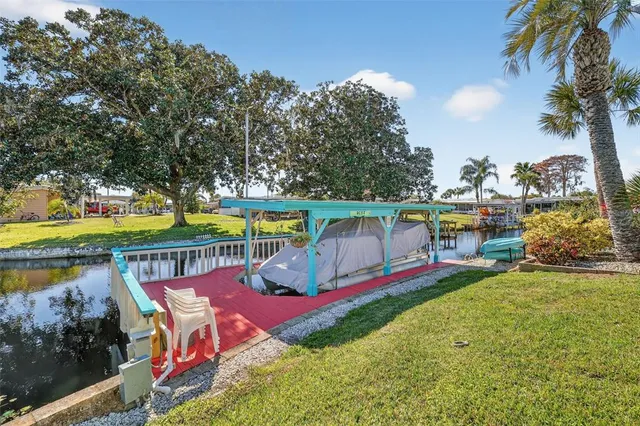 an outdoor space with furniture and lake view