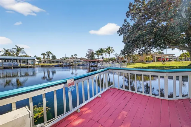 a view of wooden balcony with outdoor seating