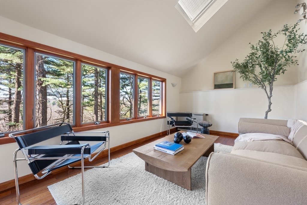 40 Hobbs Brook Road Weston, MA 02493 - Photo 19 of 42 a living room with furniture and a large window