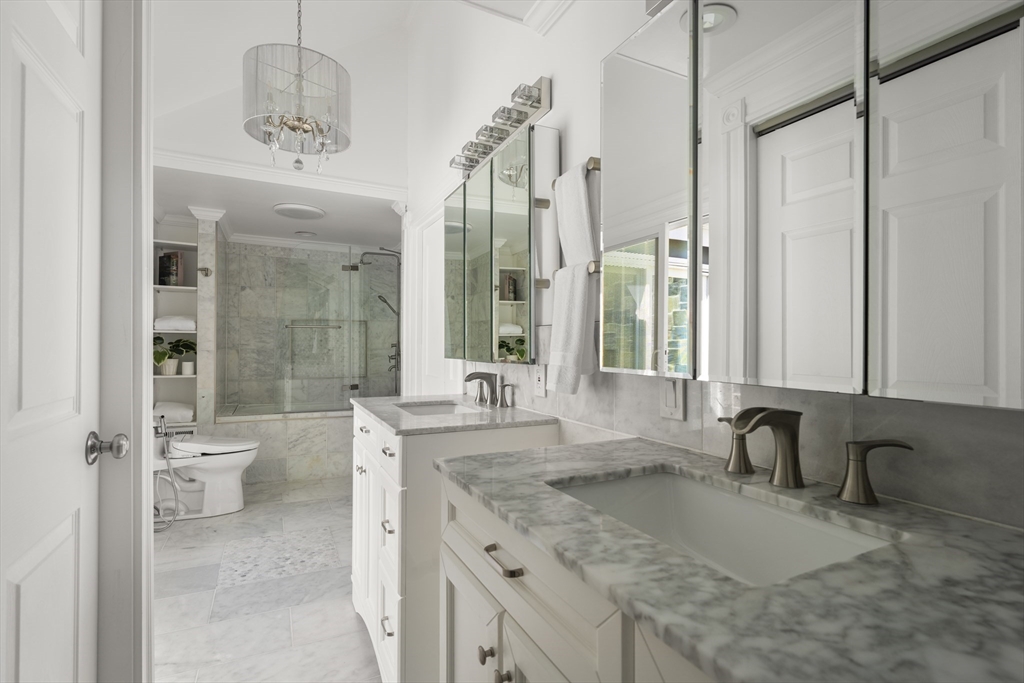 40 Hobbs Brook Road Weston, MA 02493 - Photo 29 of 42 a bathroom with a granite countertop sink and a mirror