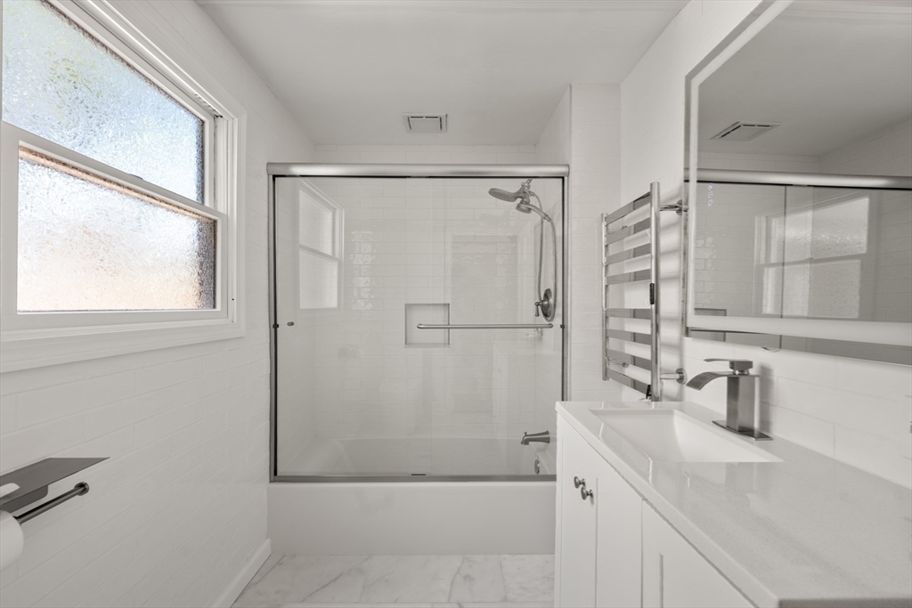 40 Hobbs Brook Road Weston, MA 02493 - Photo 31 of 42 a bathroom with a shower sink and mirror