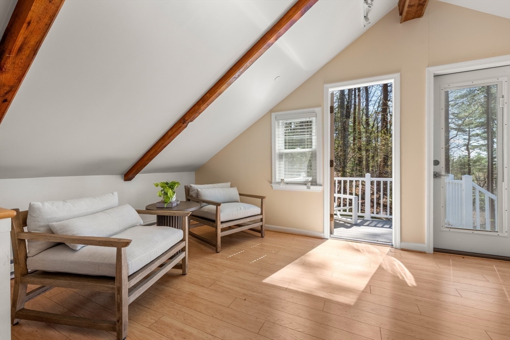40 Hobbs Brook Road Weston, MA 02493 - Photo 38 of 42 a spacious bedroom with a bed and wooden floor