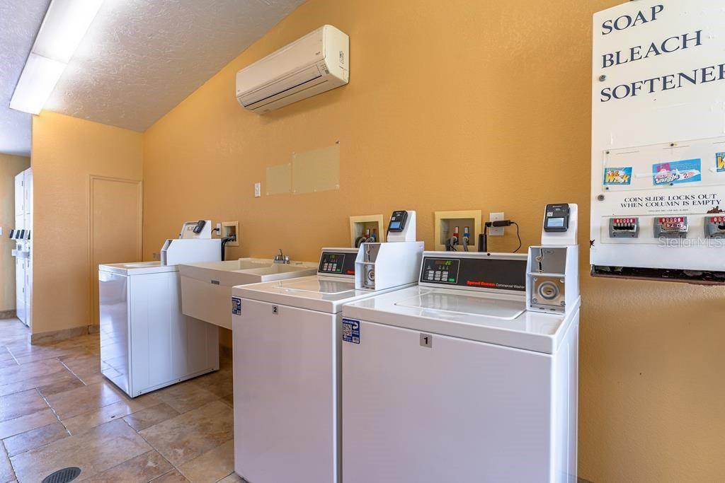 6006 Midnight Pass Road, Unit 71 Sarasota, FL 34242 - Photo 13 of 21 a room with storage and utility