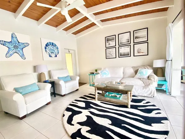 a living room with furniture and a rug