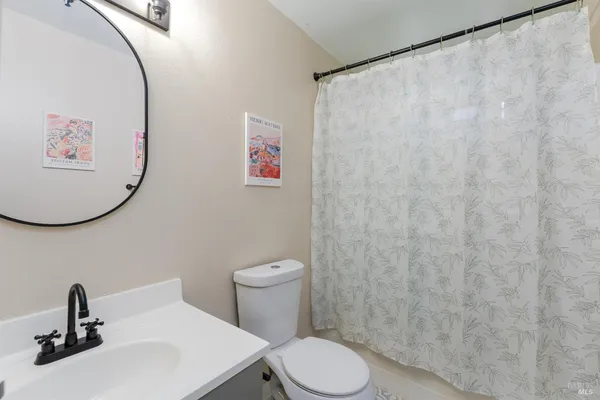 a bathroom with a toilet and a sink