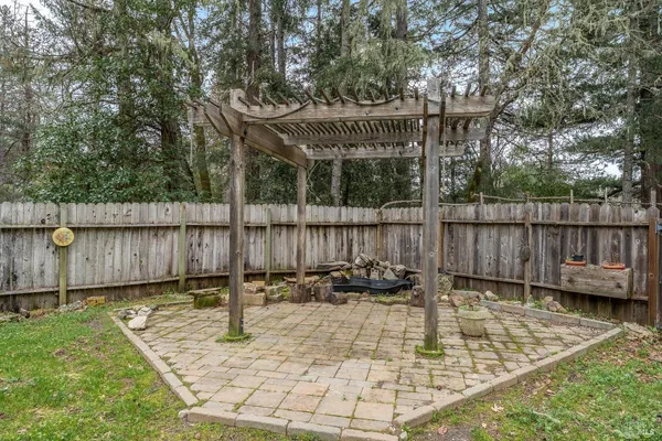 a view of a wooden deck with furniture