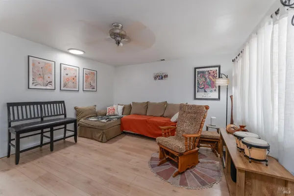 a living room with furniture and a window