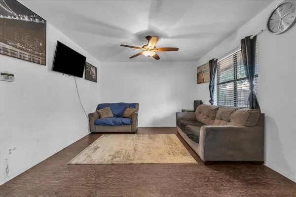 a kitchen with kitchen island a stove a table and chairs in it
