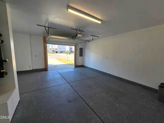 a view of a livingroom with a ceiling fan and window