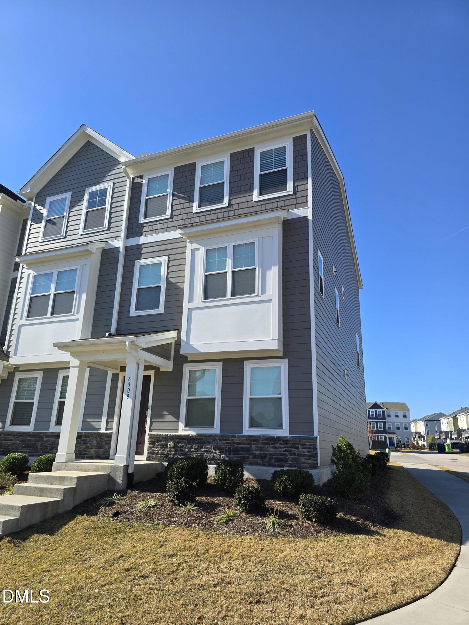 6309 Truxton Lane Raleigh, NC 27616 - Photo 2 of 41 a front view of a building with a garden
