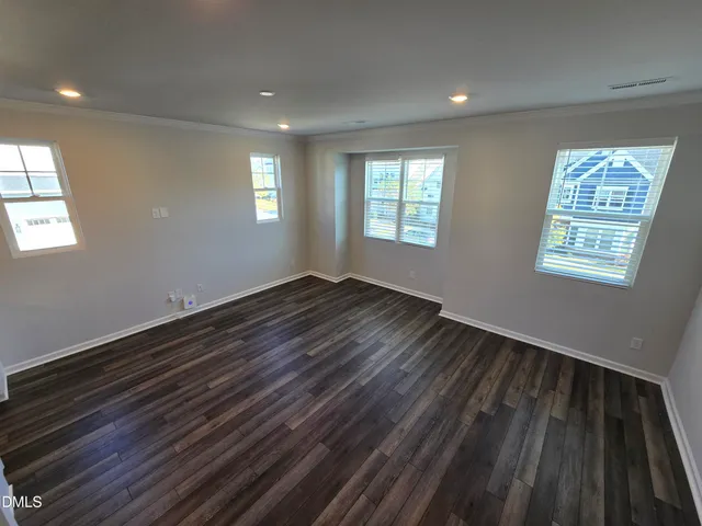 a view of an empty room and a window