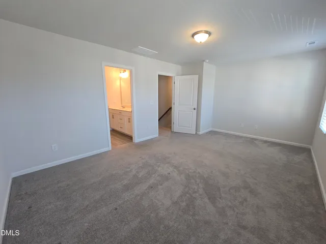 a bathroom with a double vanity sink and mirror
