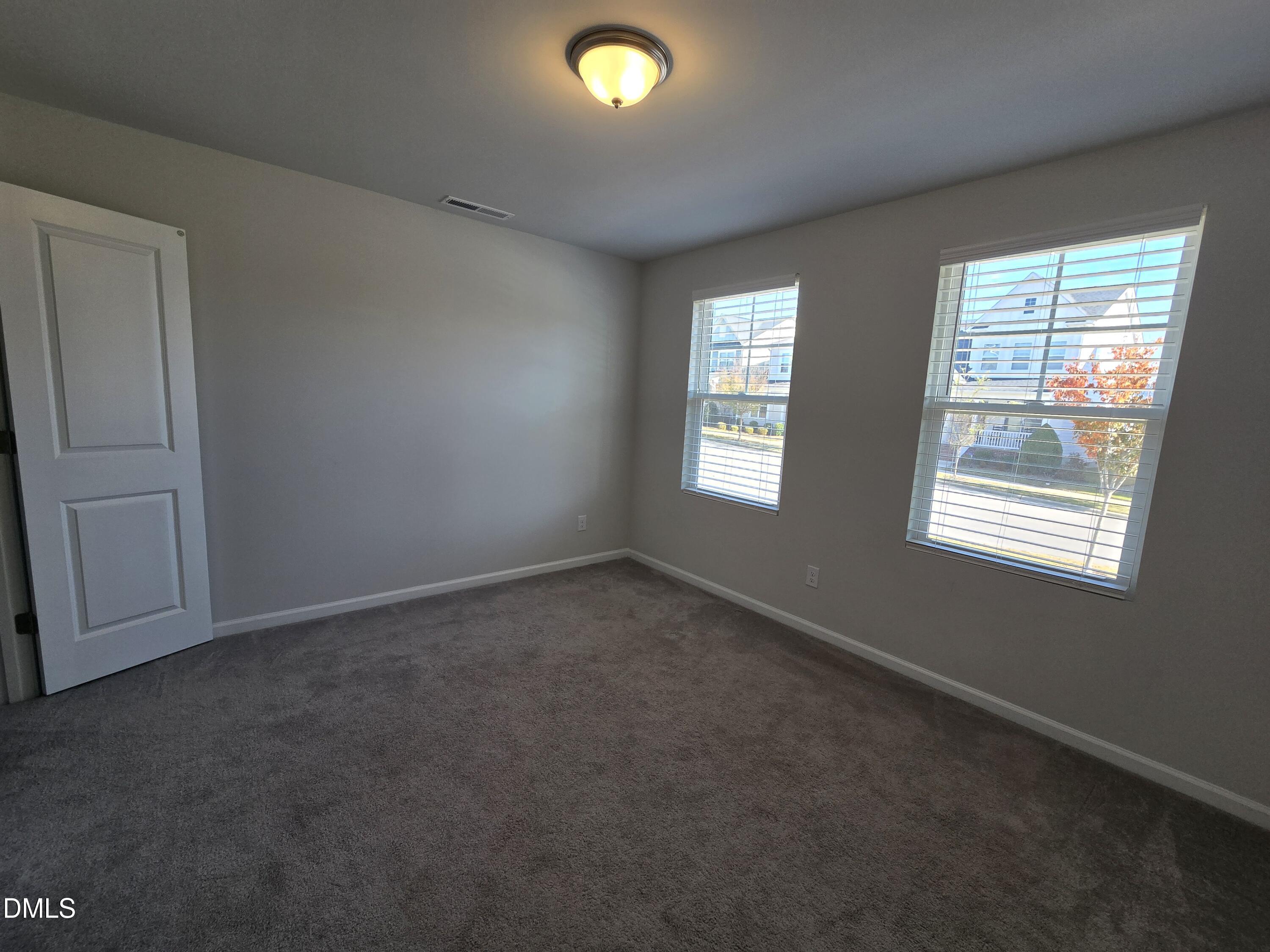 6309 Truxton Lane Raleigh, NC 27616 - Photo 6 of 41 an empty room with windows