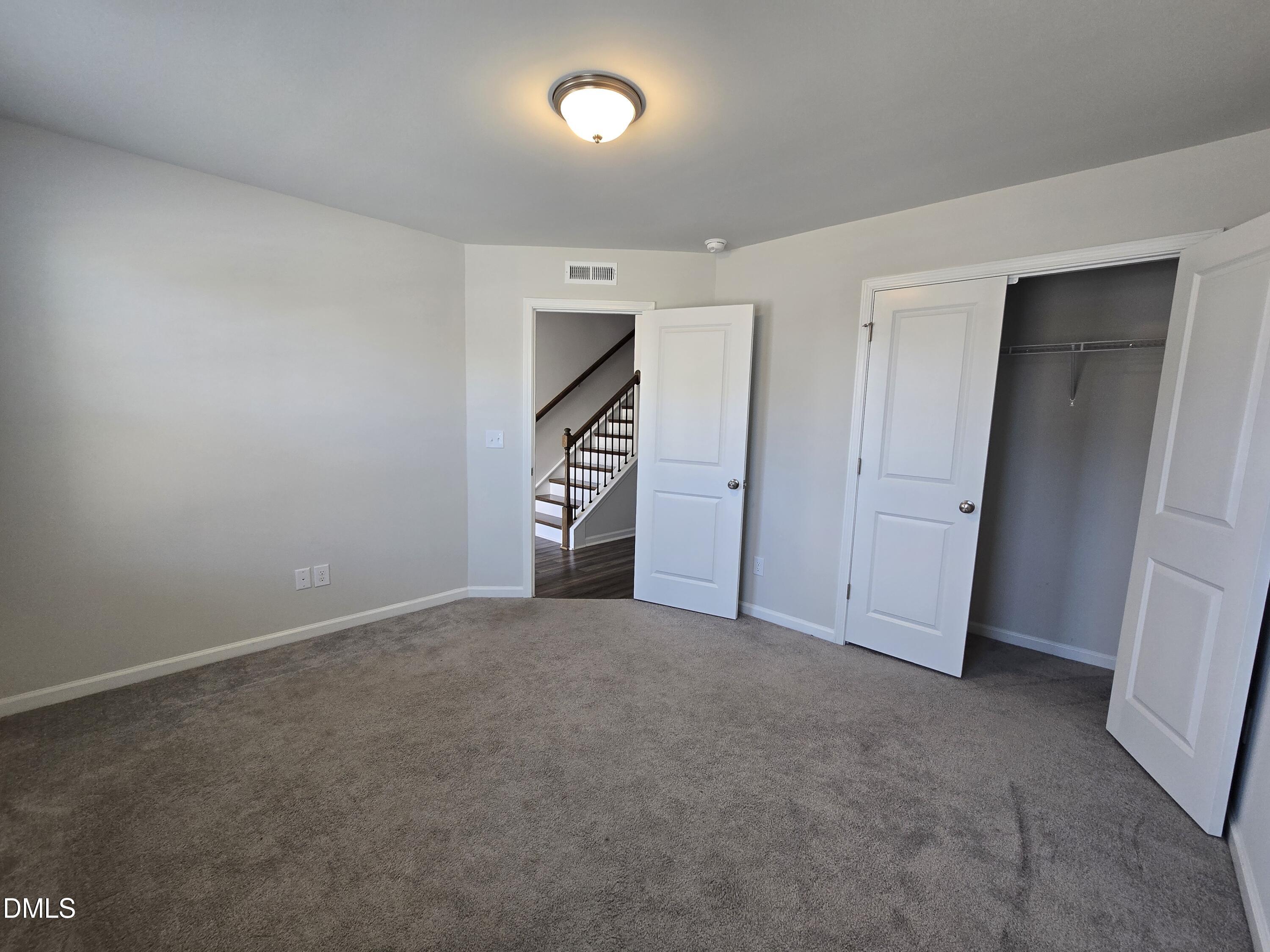 6309 Truxton Lane Raleigh, NC 27616 - Photo 7 of 41 an empty room with closet and windows