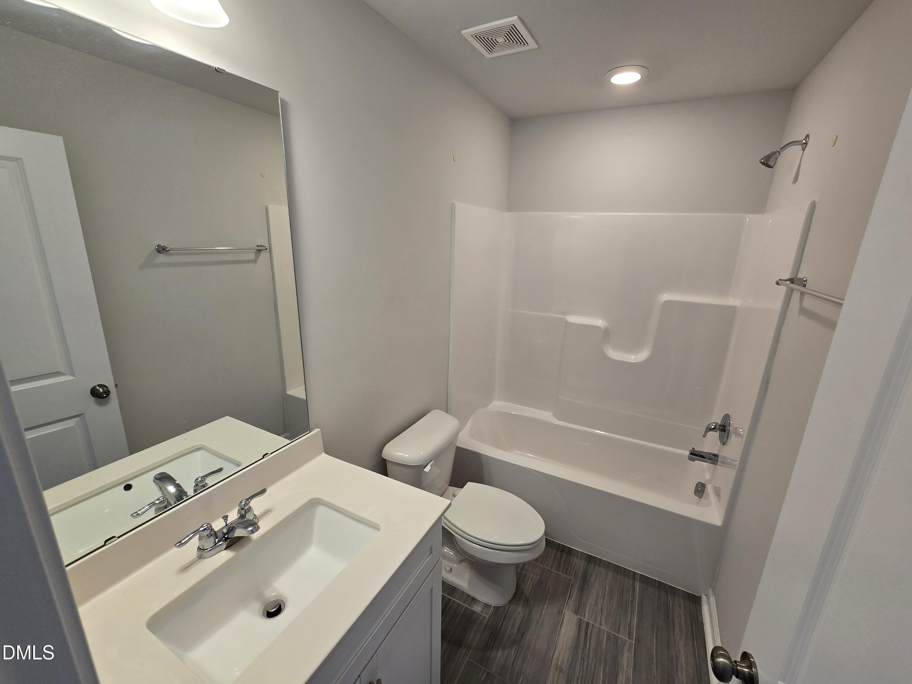 6309 Truxton Lane Raleigh, NC 27616 - Photo 8 of 41 a bathroom with a sink toilet and shower