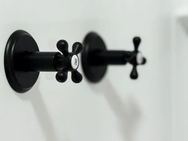 a view of staircase with railing and white walls