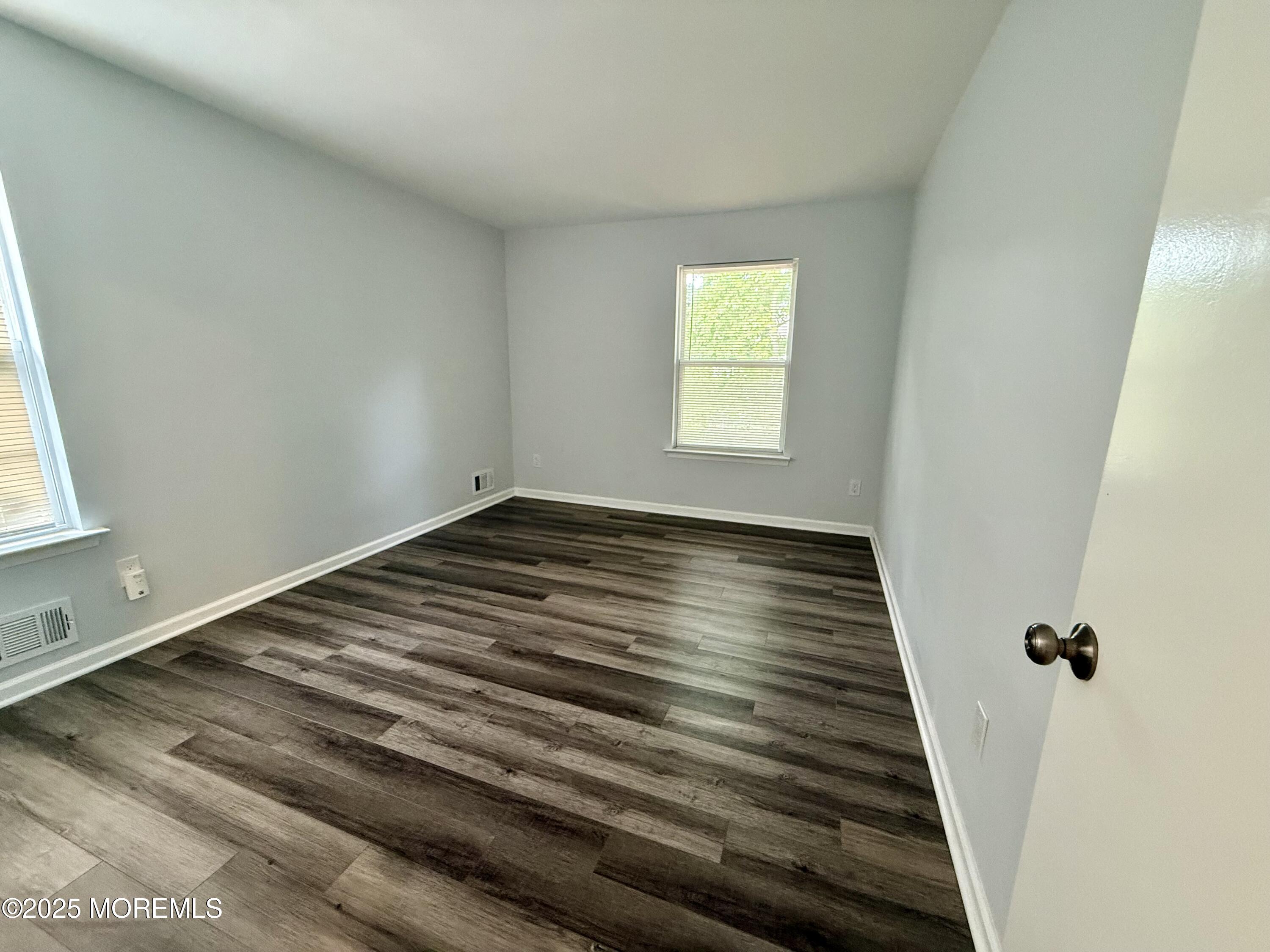 28 Atrium Way Manalapan, NJ 07726 - Photo 12 of 13 a view of a room with wooden floor and window