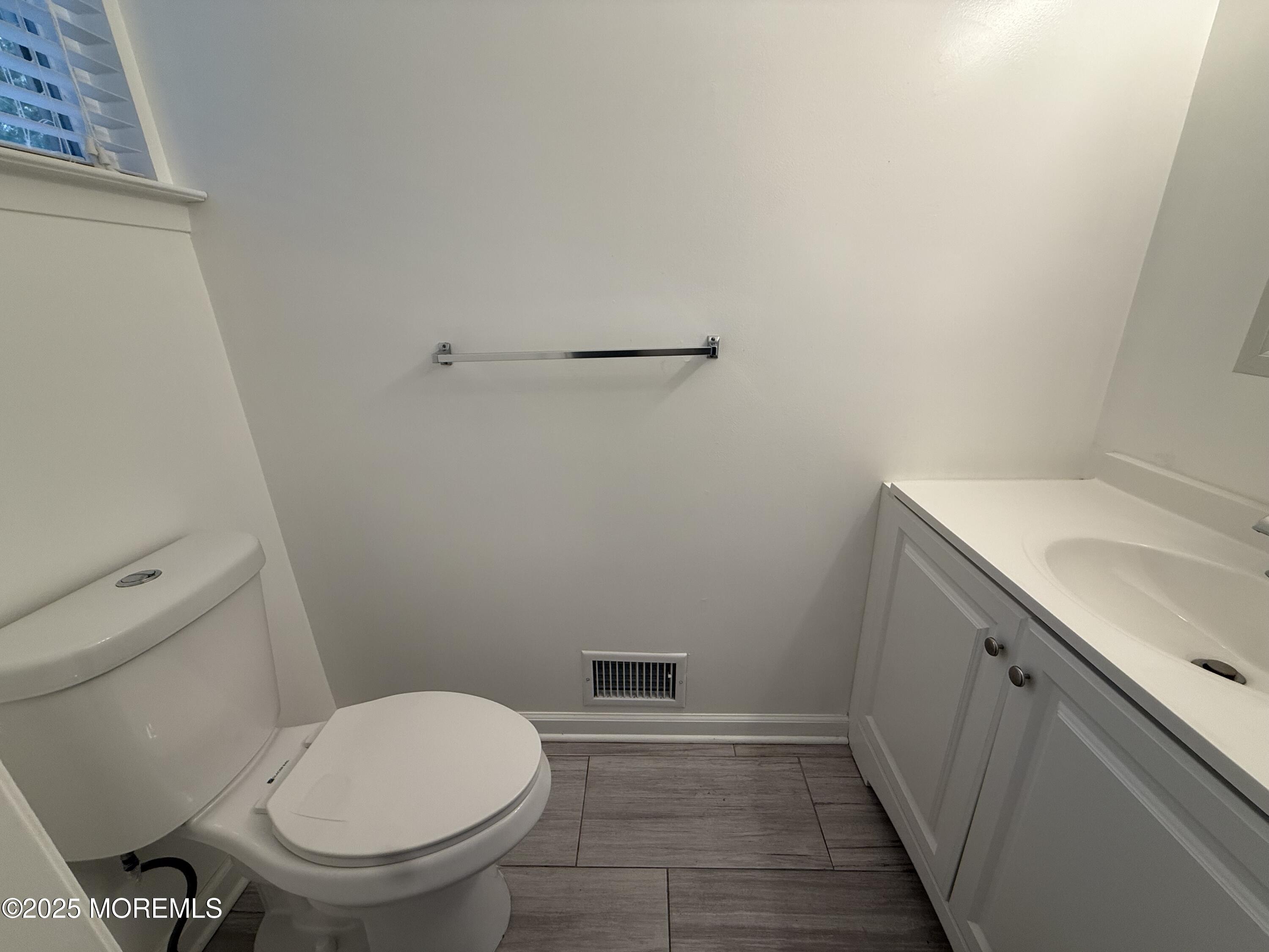 28 Atrium Way Manalapan, NJ 07726 - Photo 5 of 13 a bathroom with a sink and a toilet