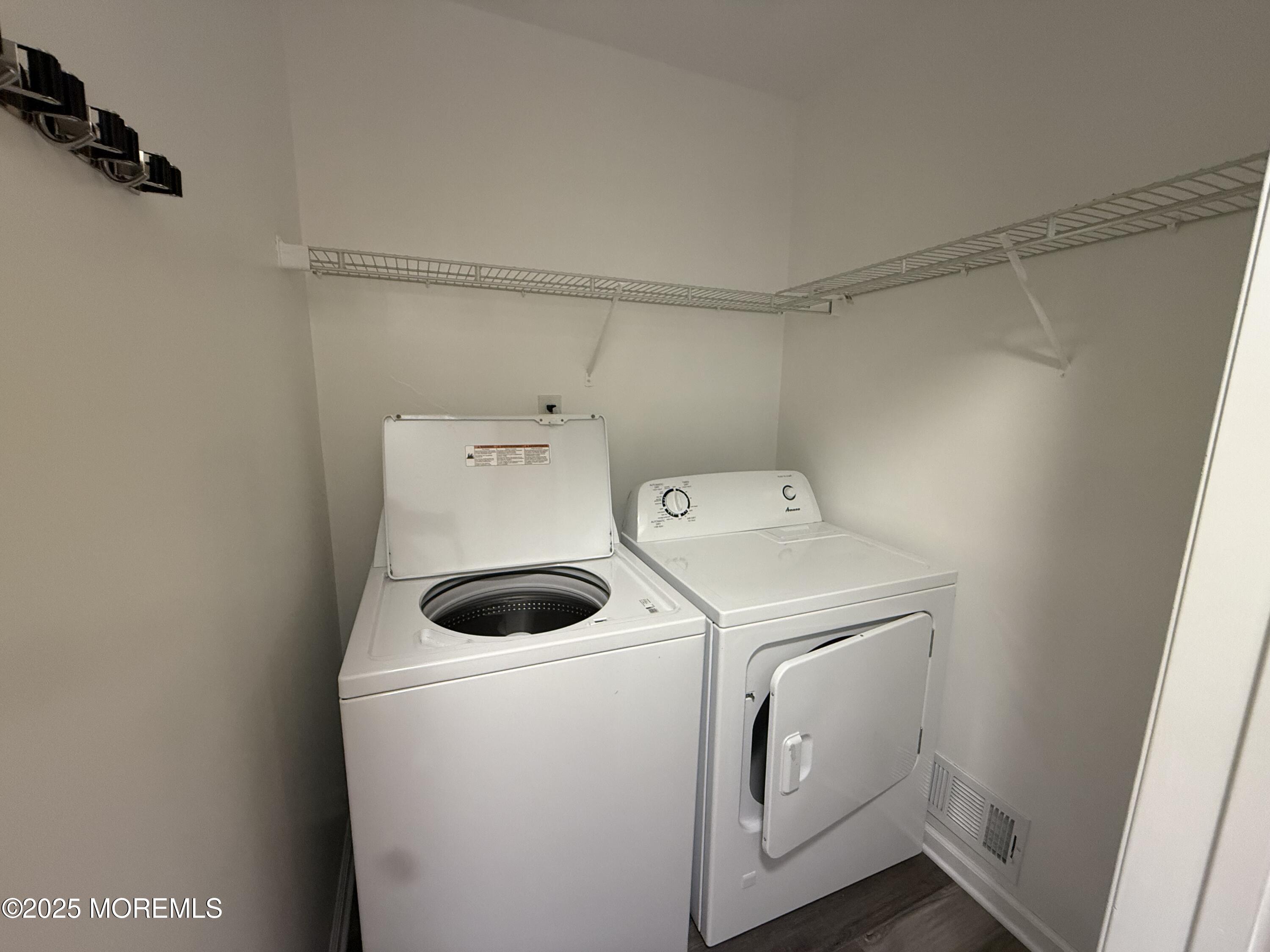 28 Atrium Way Manalapan, NJ 07726 - Photo 7 of 13 a utility room with dryer and washer