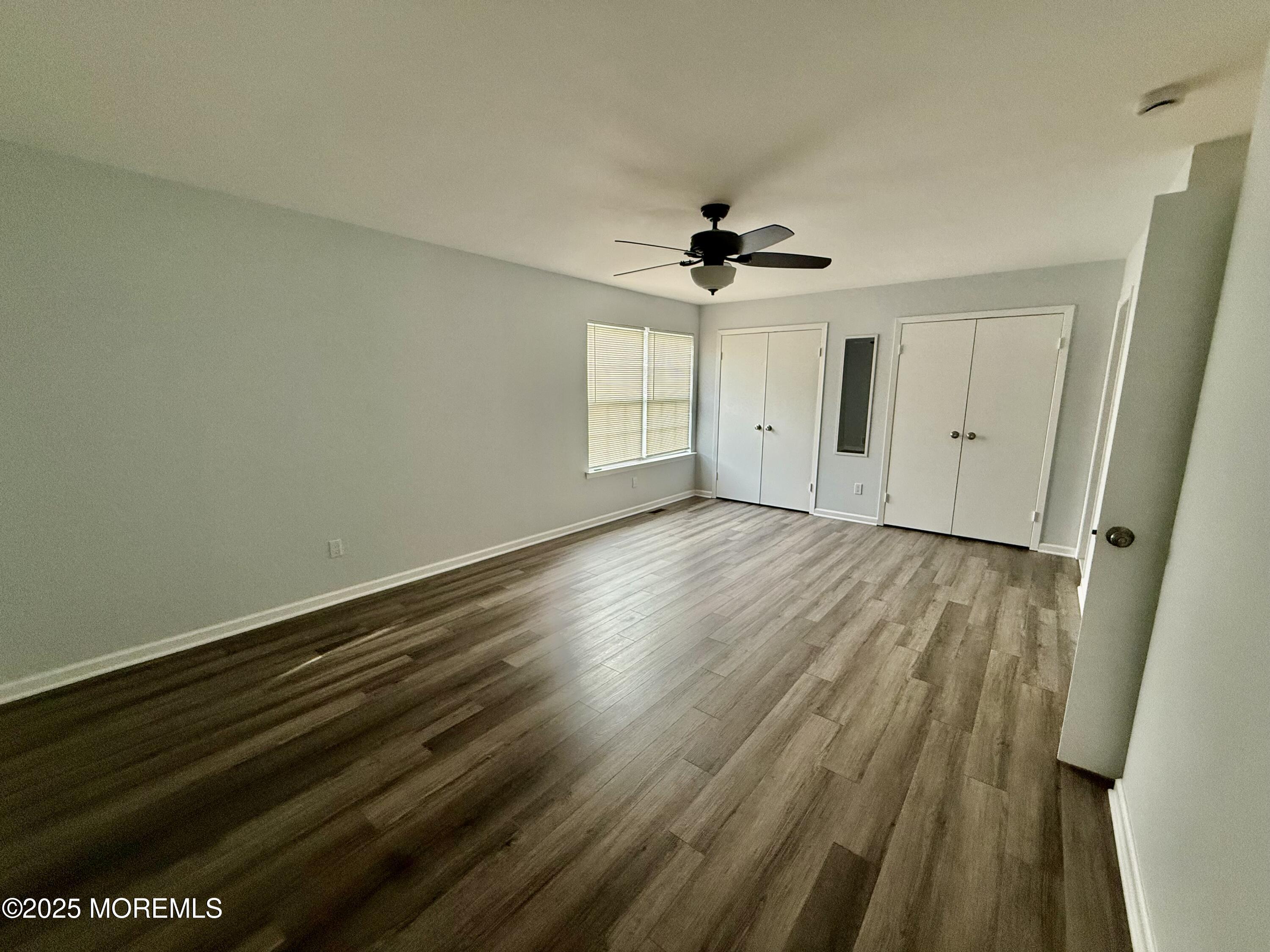 28 Atrium Way Manalapan, NJ 07726 - Photo 9 of 13 wooden floor in an empty room