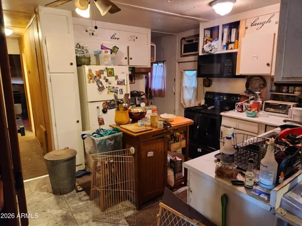 a bed room with a bed a mirror and a desk