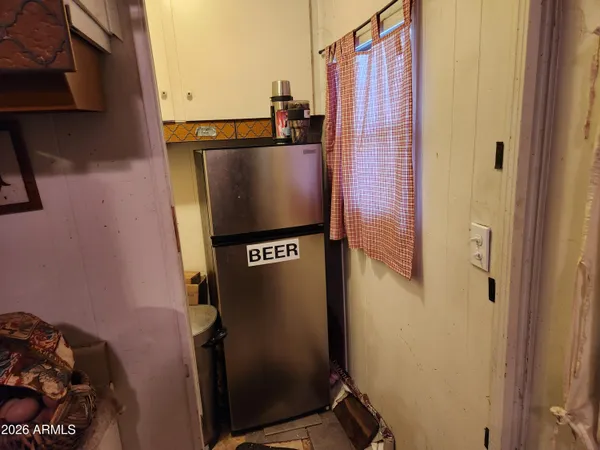 a view of walk in closet with clothes