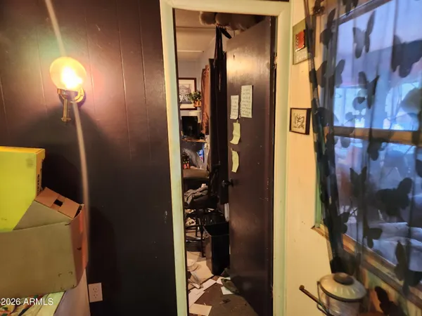 a bathroom with a toilet and a mirror