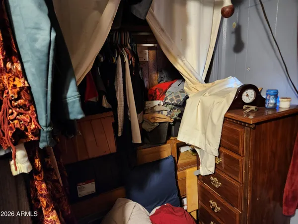 a view of a patio with table and chairs a barbeque and wooden fence