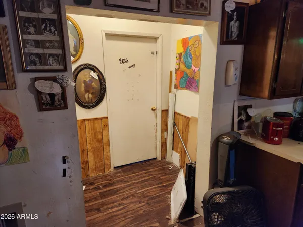 a view of a backyard with wooden fence