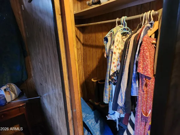 a view of a house with a yard covered in snow