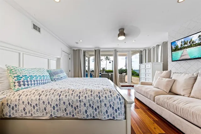 a bedroom with a large bed and a couch