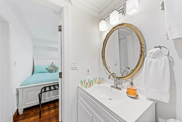 a bathroom with a sink and a mirror