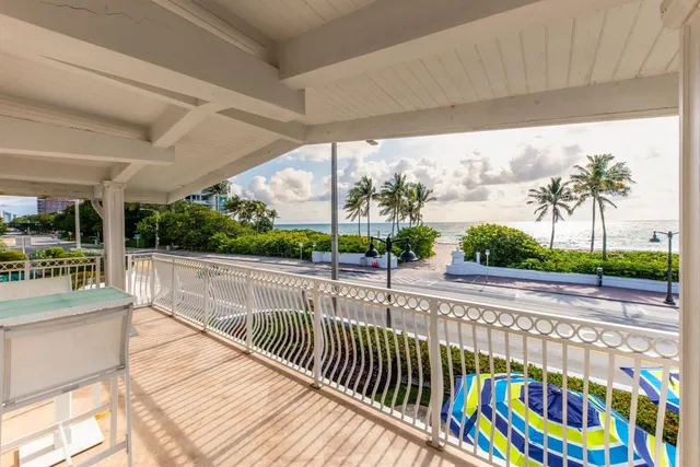 a view of balcony with furniture