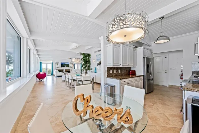 a living room with furniture a rug and a chandelier