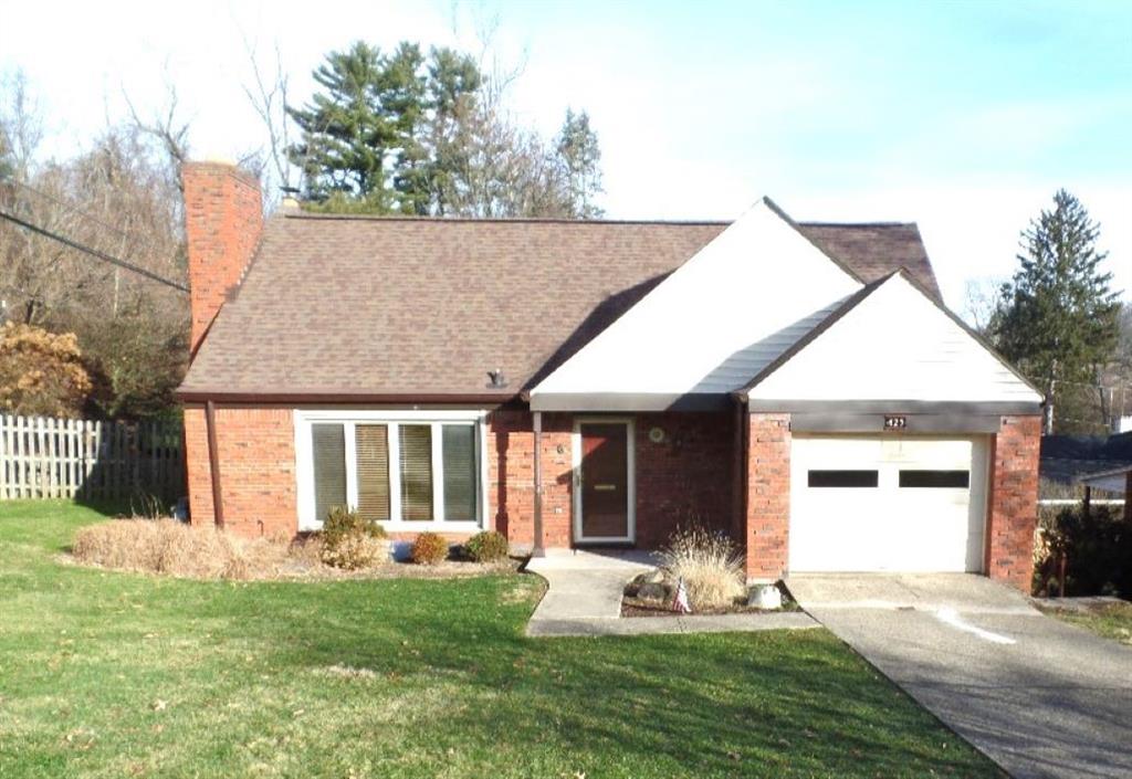 a view of a house with backyard porch and garden