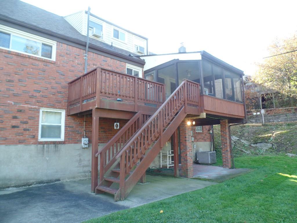 425 Kurt Drive Pittsburgh, PA 15243 - Photo 21 of 43 a view of a house with a yard and deck