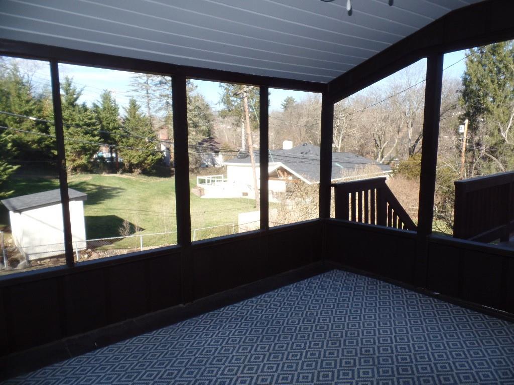 425 Kurt Drive Pittsburgh, PA 15243 - Photo 26 of 43 a living room with large windows