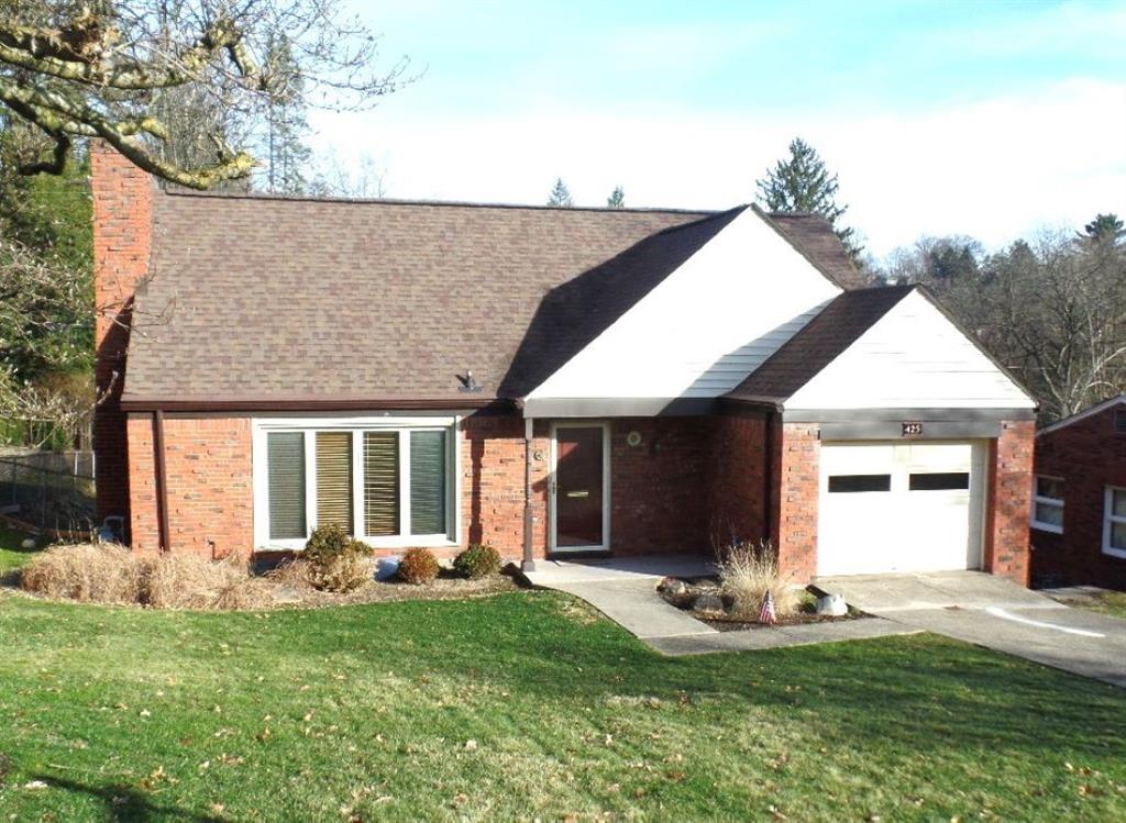 425 Kurt Drive Pittsburgh, PA 15243 - Photo 36 of 43 a front view of a house with a yard and garage