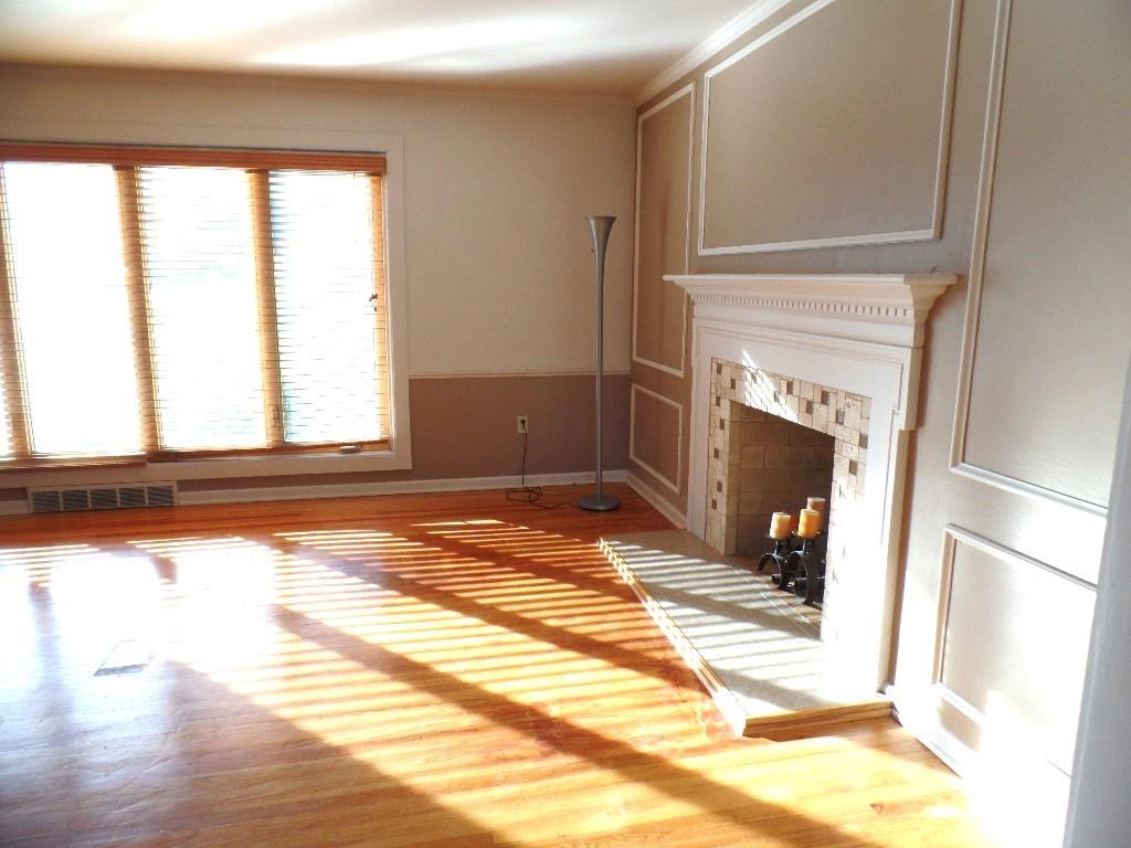 425 Kurt Drive Pittsburgh, PA 15243 - Photo 40 of 43 a view of a livingroom with wooden floor and a fireplace
