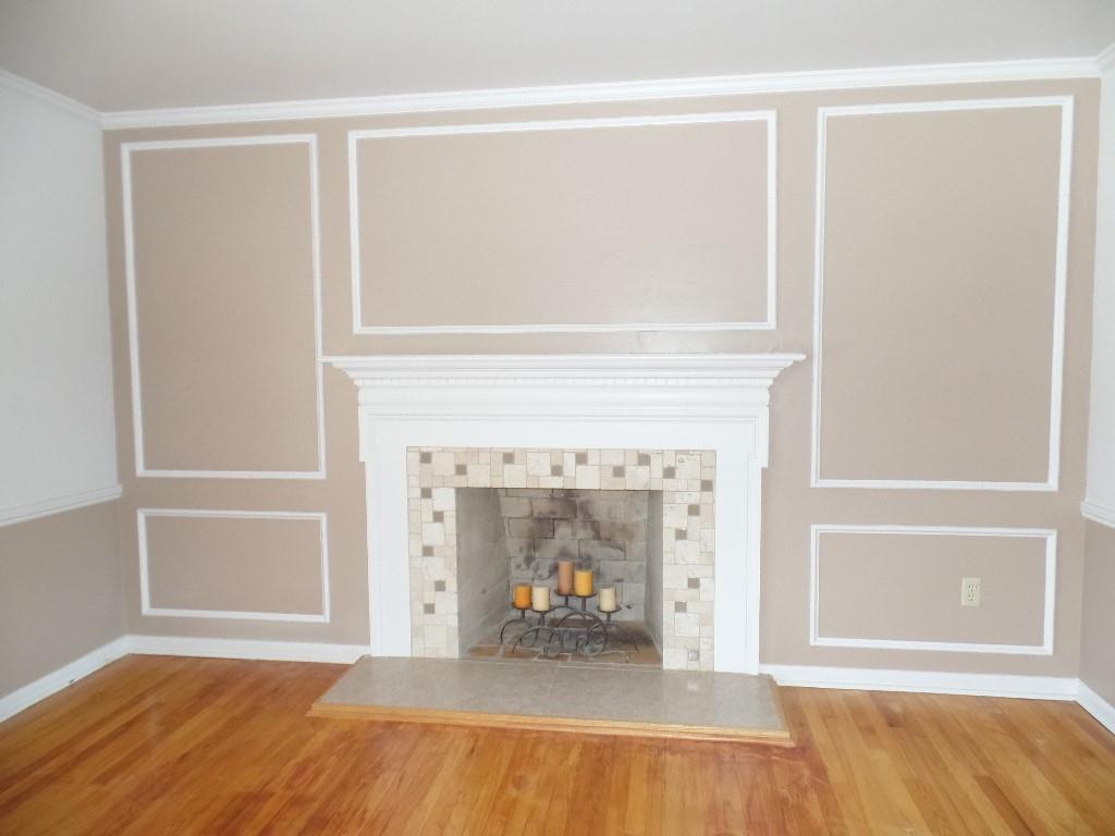 425 Kurt Drive Pittsburgh, PA 15243 - Photo 5 of 43 a view of an empty room with wooden floor and a fireplace