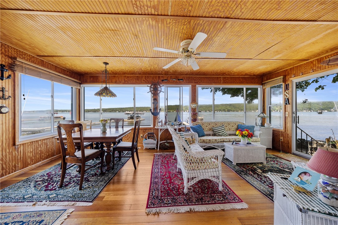 5317 West Lake Road Geneseo, NY 14454 - Photo 19 of 50 SPECTACULAR SUNROOM WITH WALL OF WINDOWS & LAKE VI