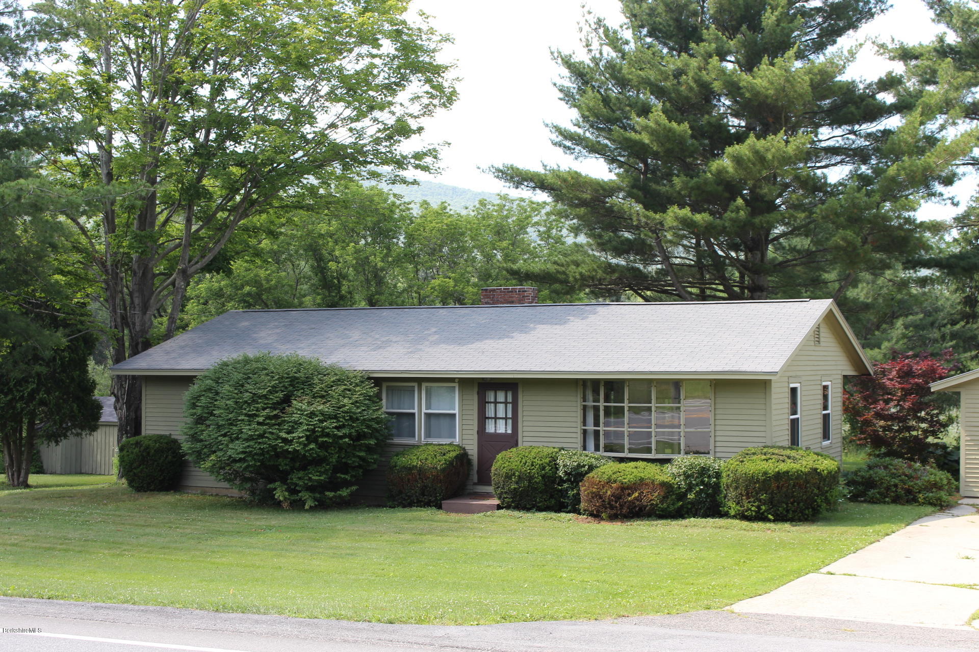 429 Hancock Road Williamstown, MA 01267 - Photo 2 of 33 a front view of a house with a yard and garage