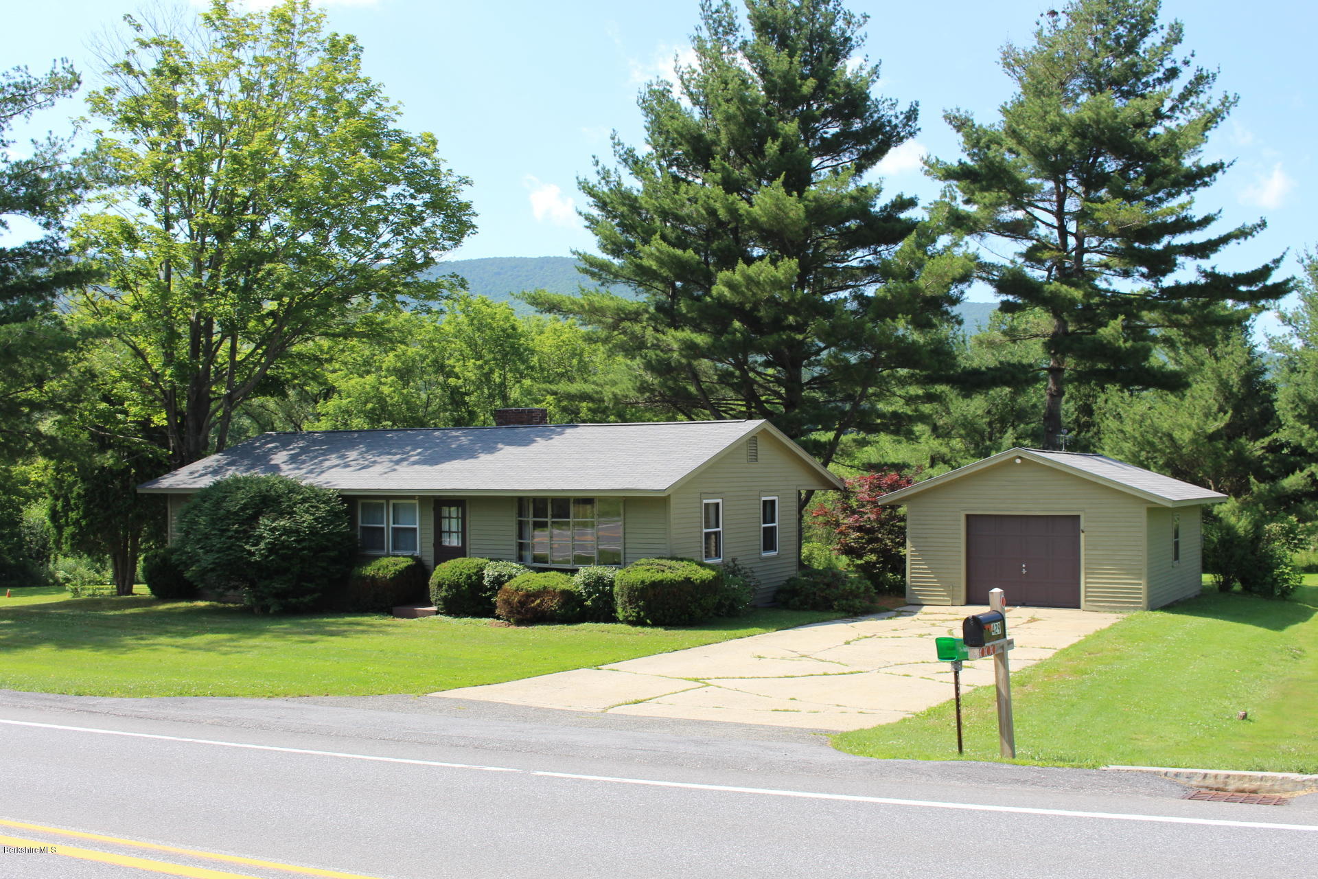 429 Hancock Road Williamstown, MA 01267 - Photo 33 of 33 a front view of a house with a yard and garage