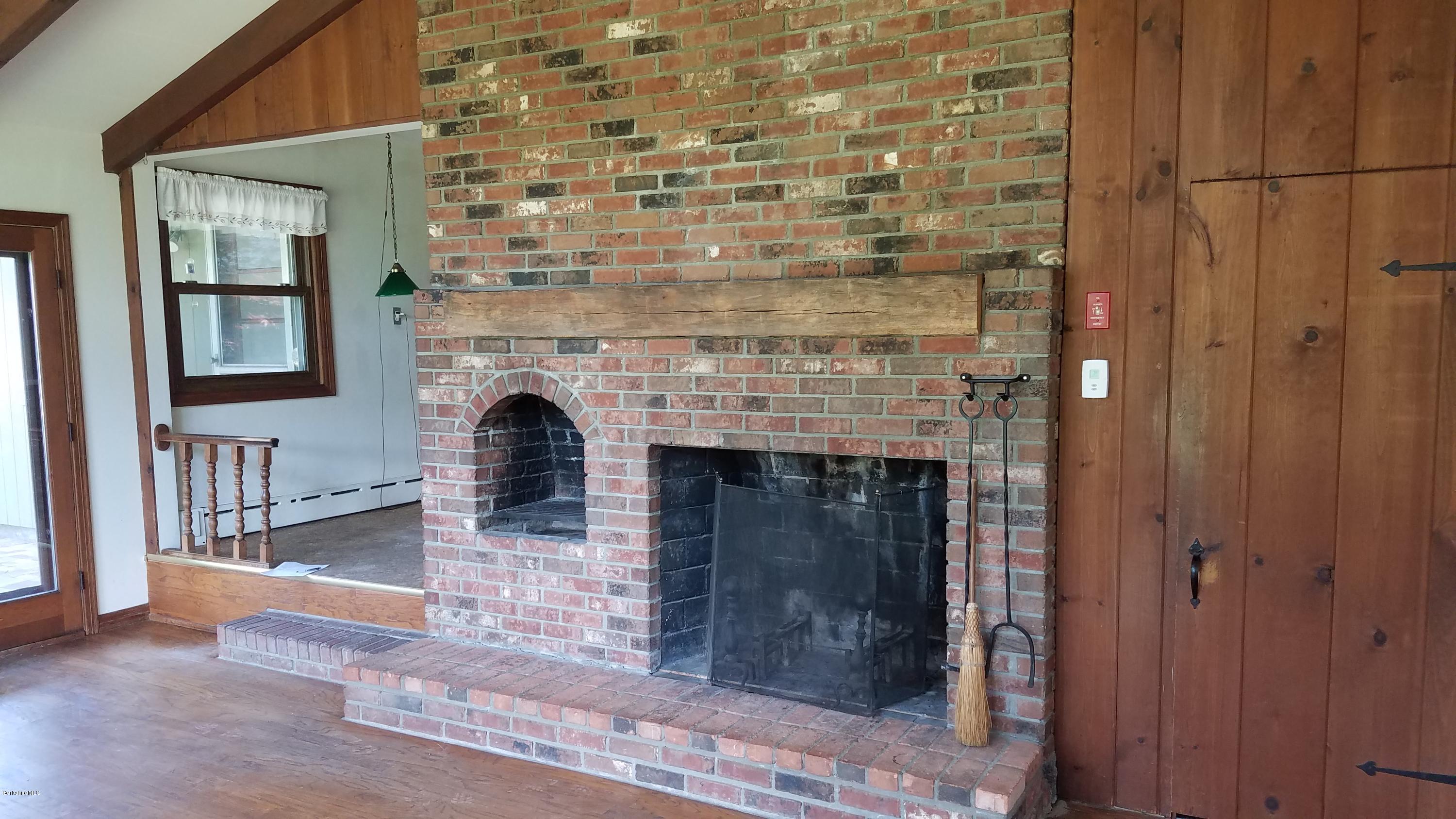 429 Hancock Road Williamstown, MA 01267 - Photo 8 of 33 a living room with a fireplace