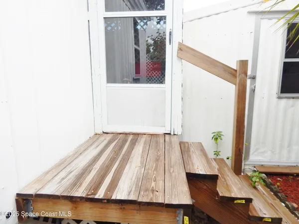 a view of a room with workspace and toys