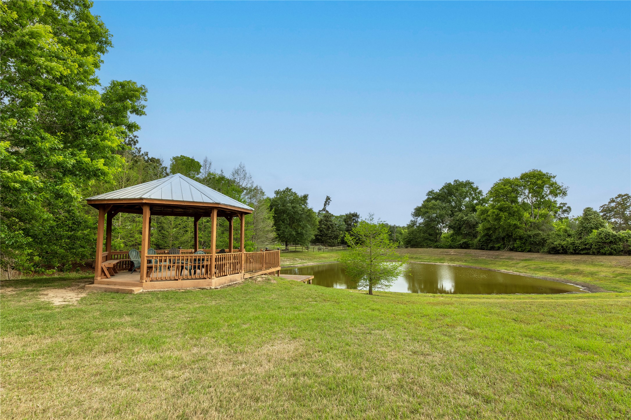 119 Heritage Trail Bellville, TX 77418 - Photo 19 of 20 a backyard of a house with yard table and chairs