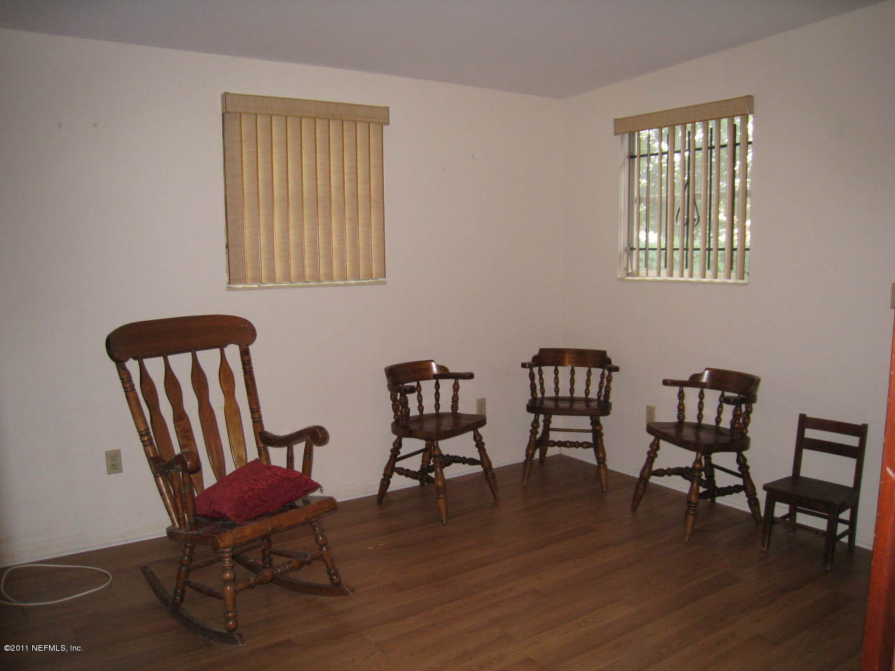 7418 Centauri Road Jacksonville, FL 32210 - Photo 12 of 22 a view of a workspace with furniture window and wooden floor