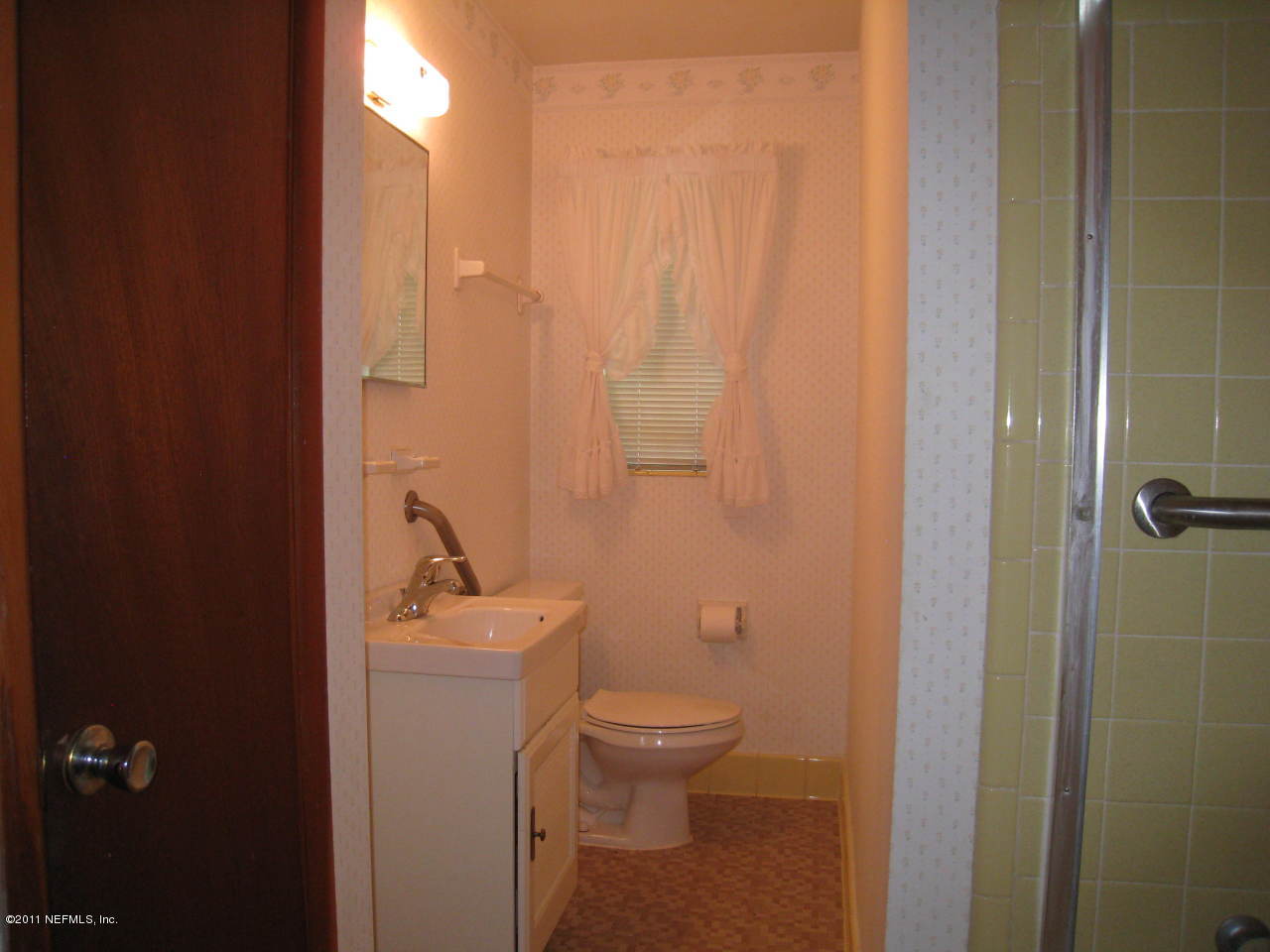 7418 Centauri Road Jacksonville, FL 32210 - Photo 16 of 22 a bathroom with a sink a toilet and shower