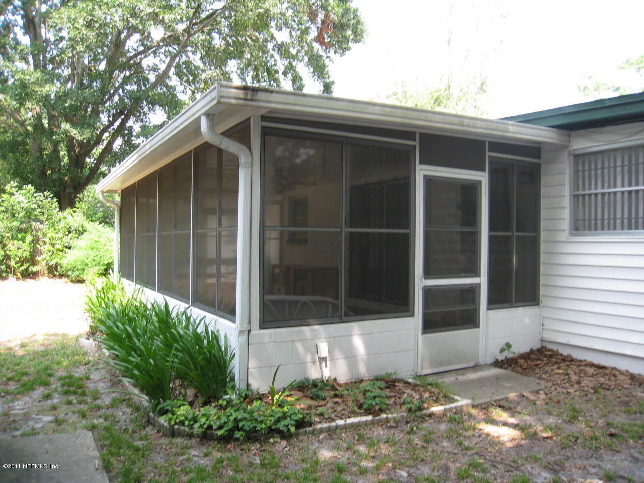7418 Centauri Road Jacksonville, FL 32210 - Photo 18 of 22 a front view of a house with a yard