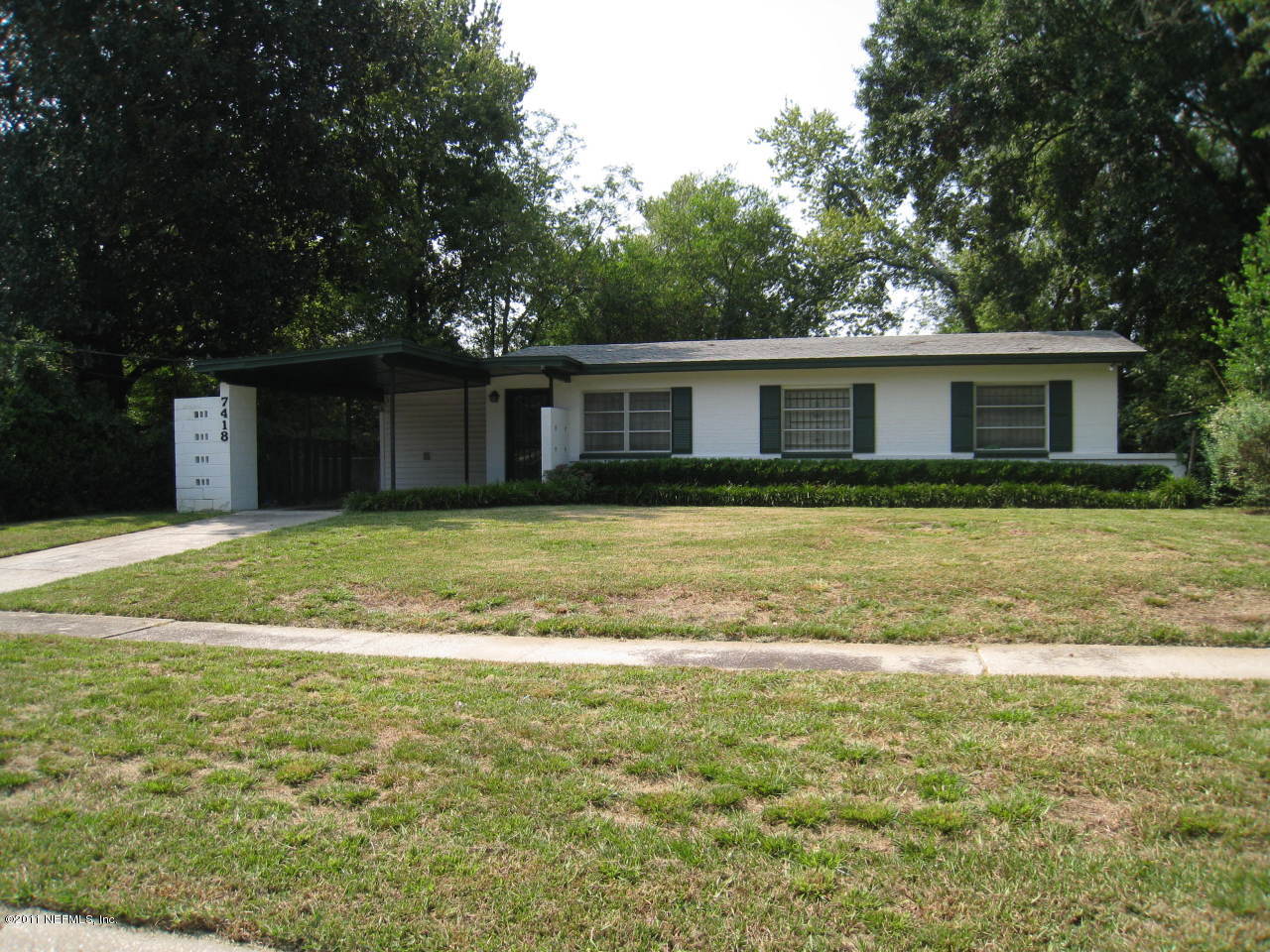7418 Centauri Road Jacksonville, FL 32210 - Photo 2 of 22 a view of a house with a yard